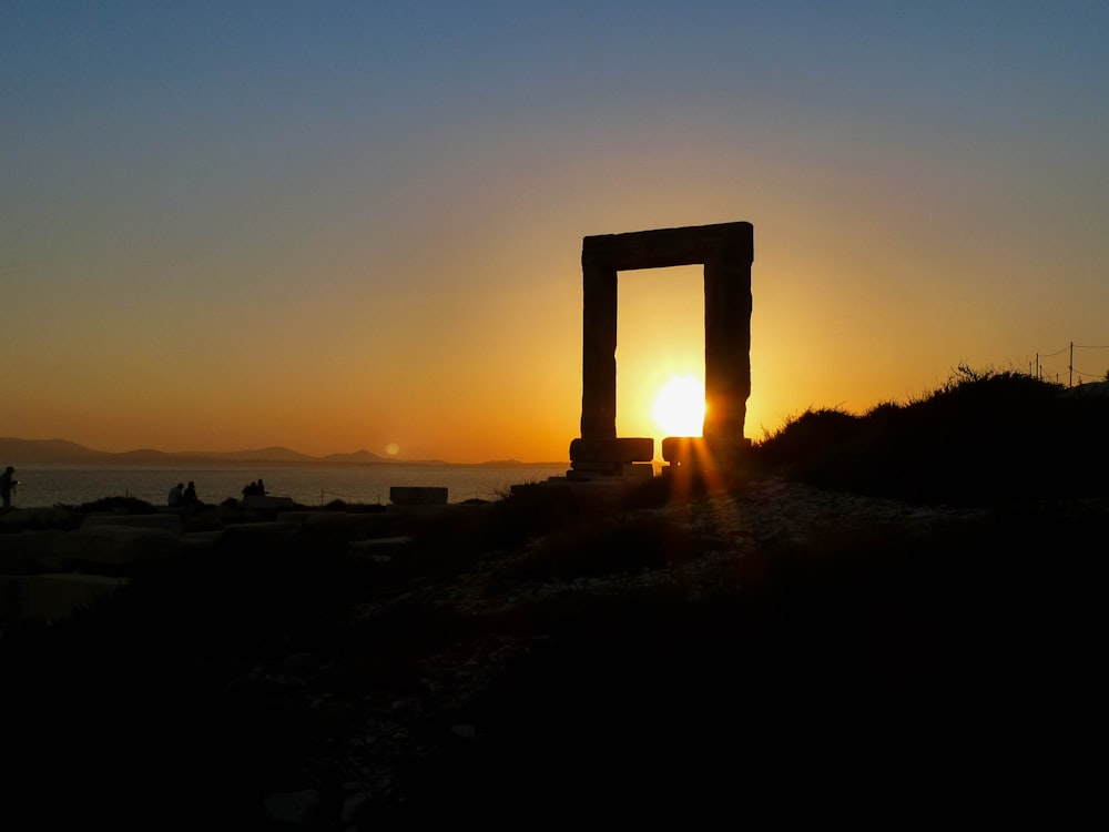 silhouette of arch during sunset