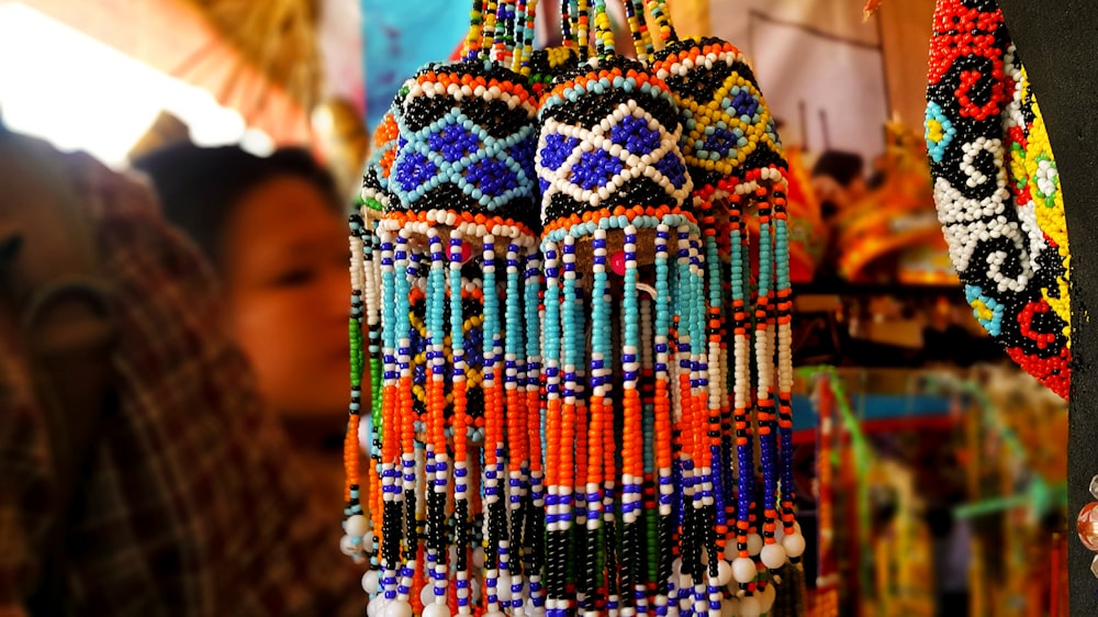 multi colored beaded necklace on brown wooden table