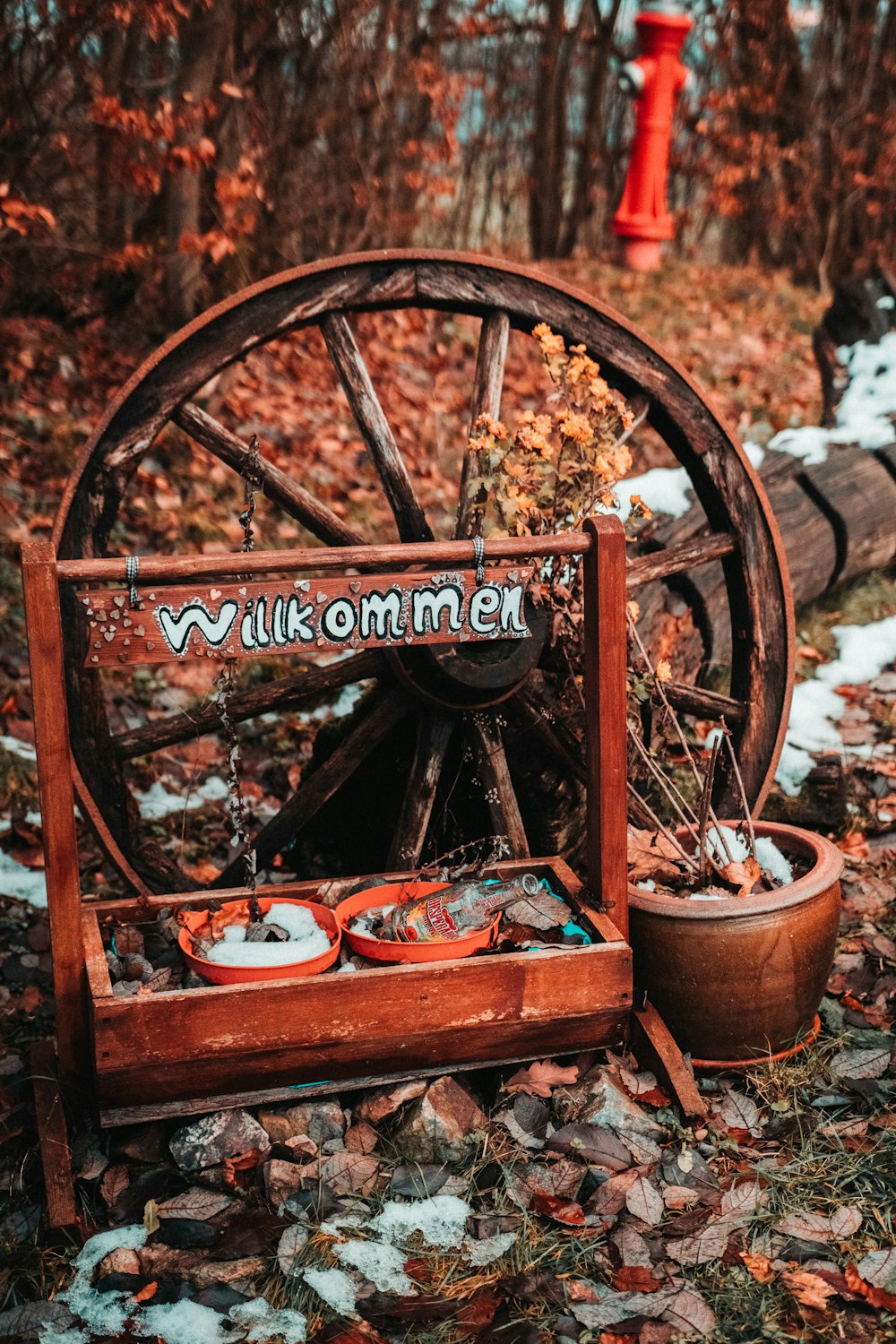 brown wooden wheel with red wooden frame