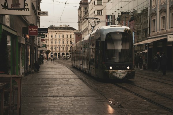 White and black tram on road during daytime — Linz, Austria