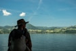woman in black tank top wearing brown hat standing near body of water during daytime