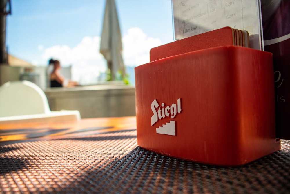 red and white box on table