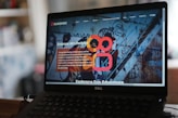 black laptop computer turned on displaying game application