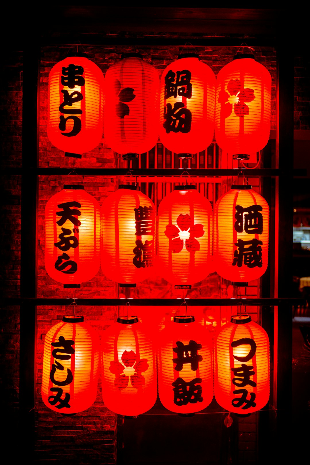 red chinese lanterns on brown wooden window