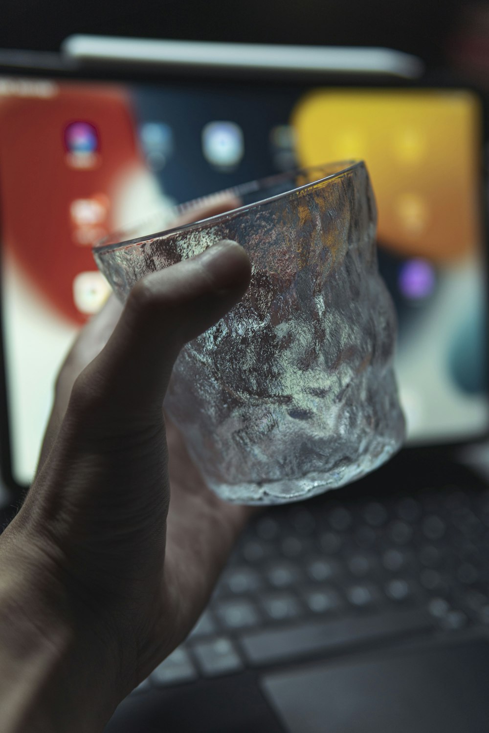 person holding clear glass cup