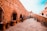 people walking on brown brick building during daytime