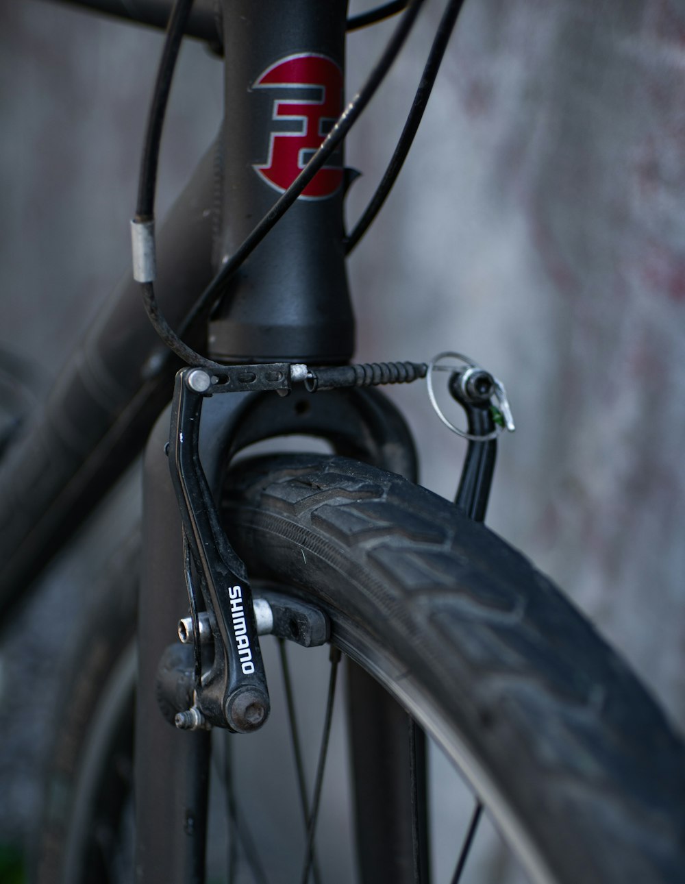 black bicycle wheel in close up photography