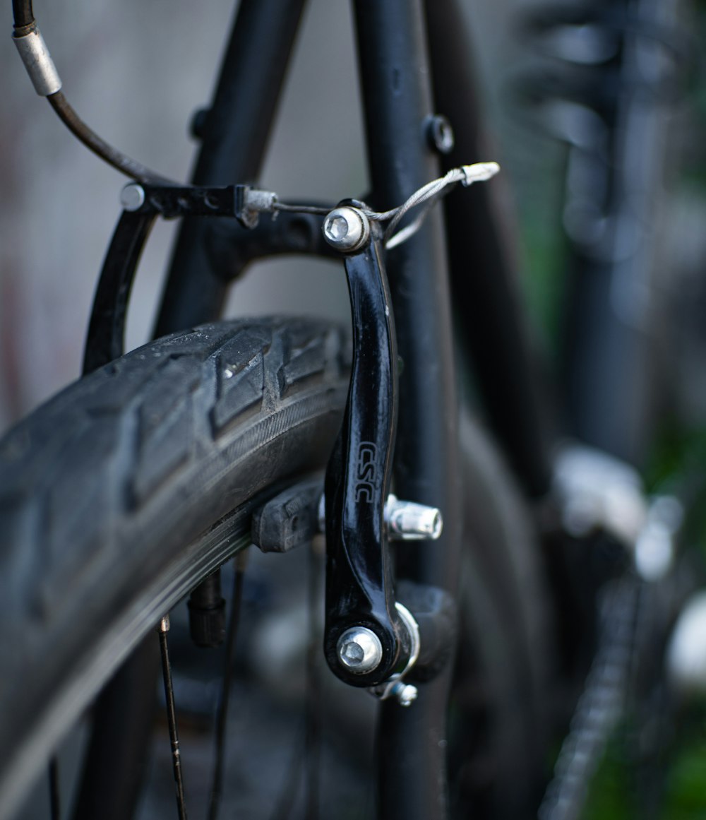 black bicycle wheel in close up photography