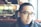 man in black framed eyeglasses and black jacket
