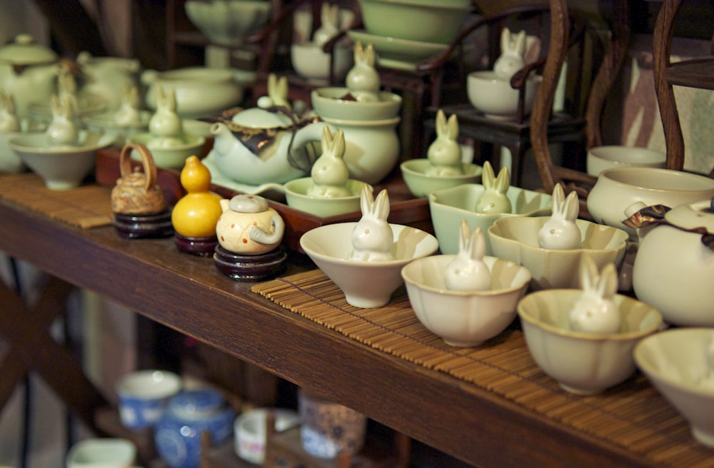 white ceramic bowl on brown wooden shelf