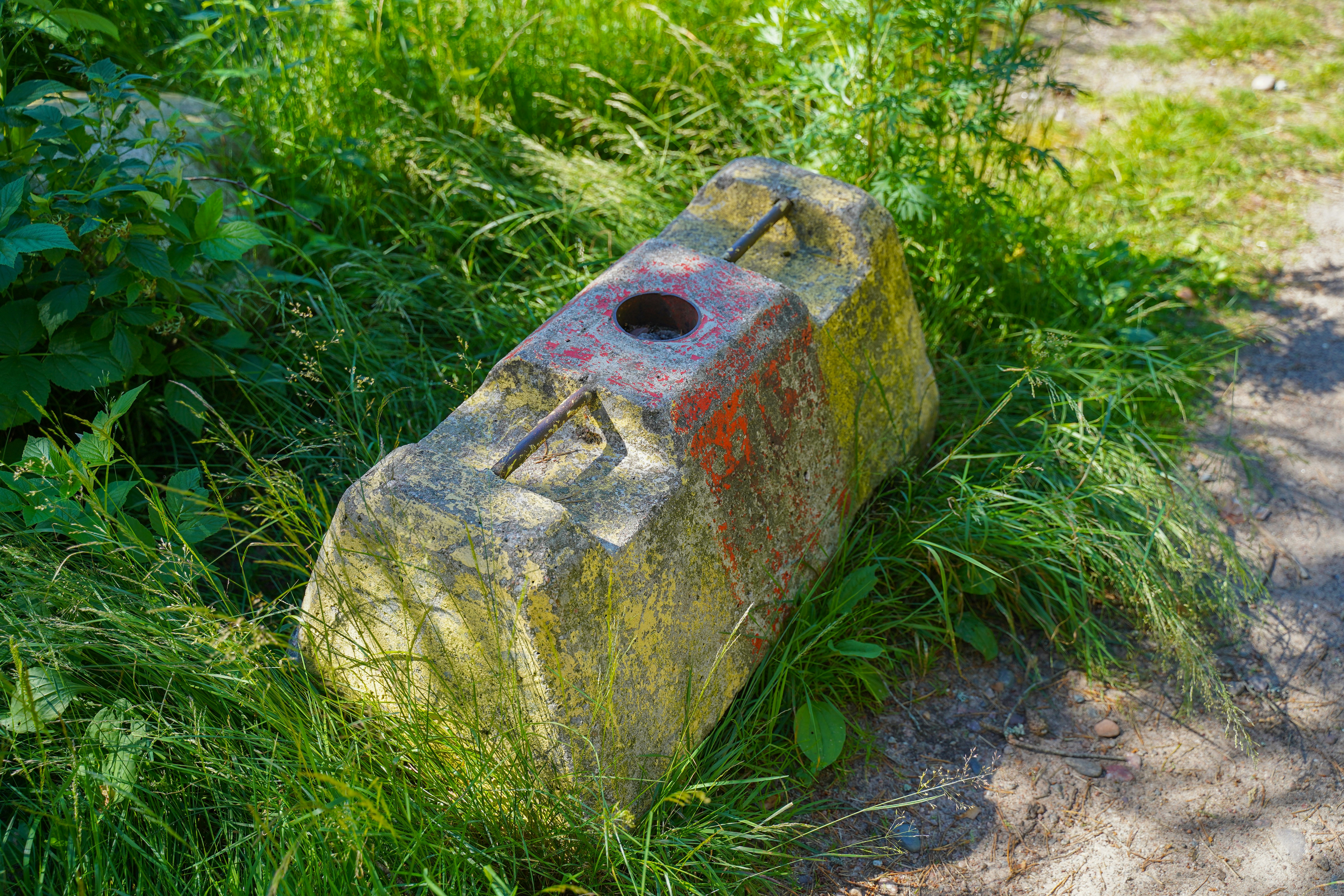 red and brown concrete brick on green grass