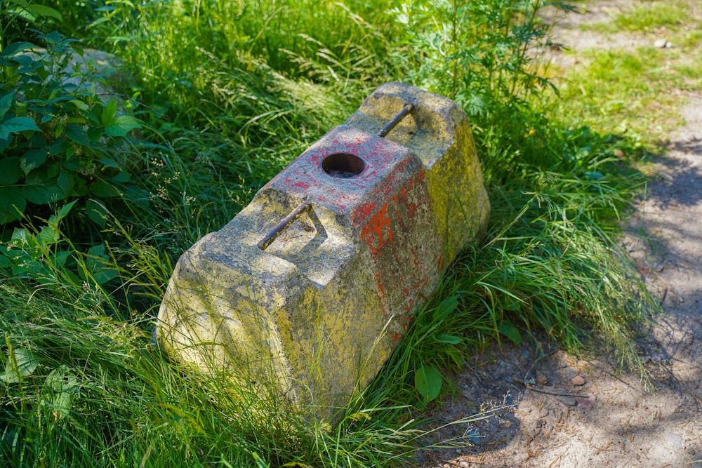 red and brown concrete brick on green grass