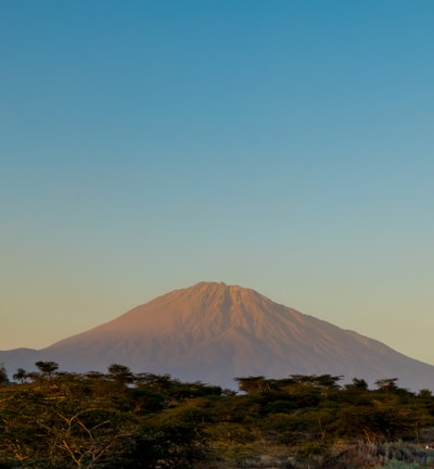 brown mountain under blue sky during daytime