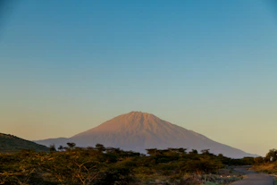 brown mountain under blue sky during daytime