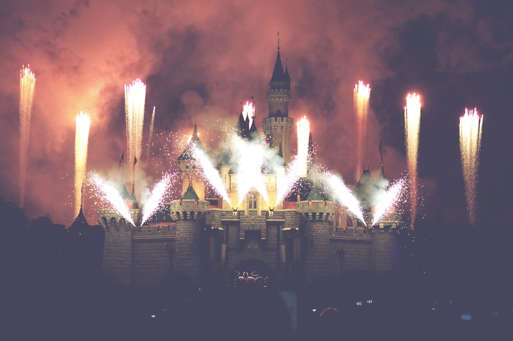 fireworks display over city buildings during night time