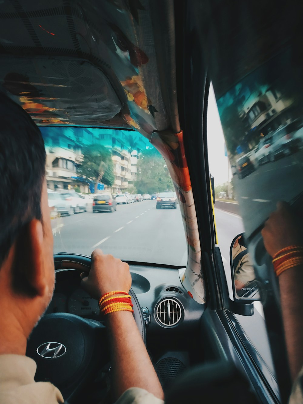 man driving car during daytime