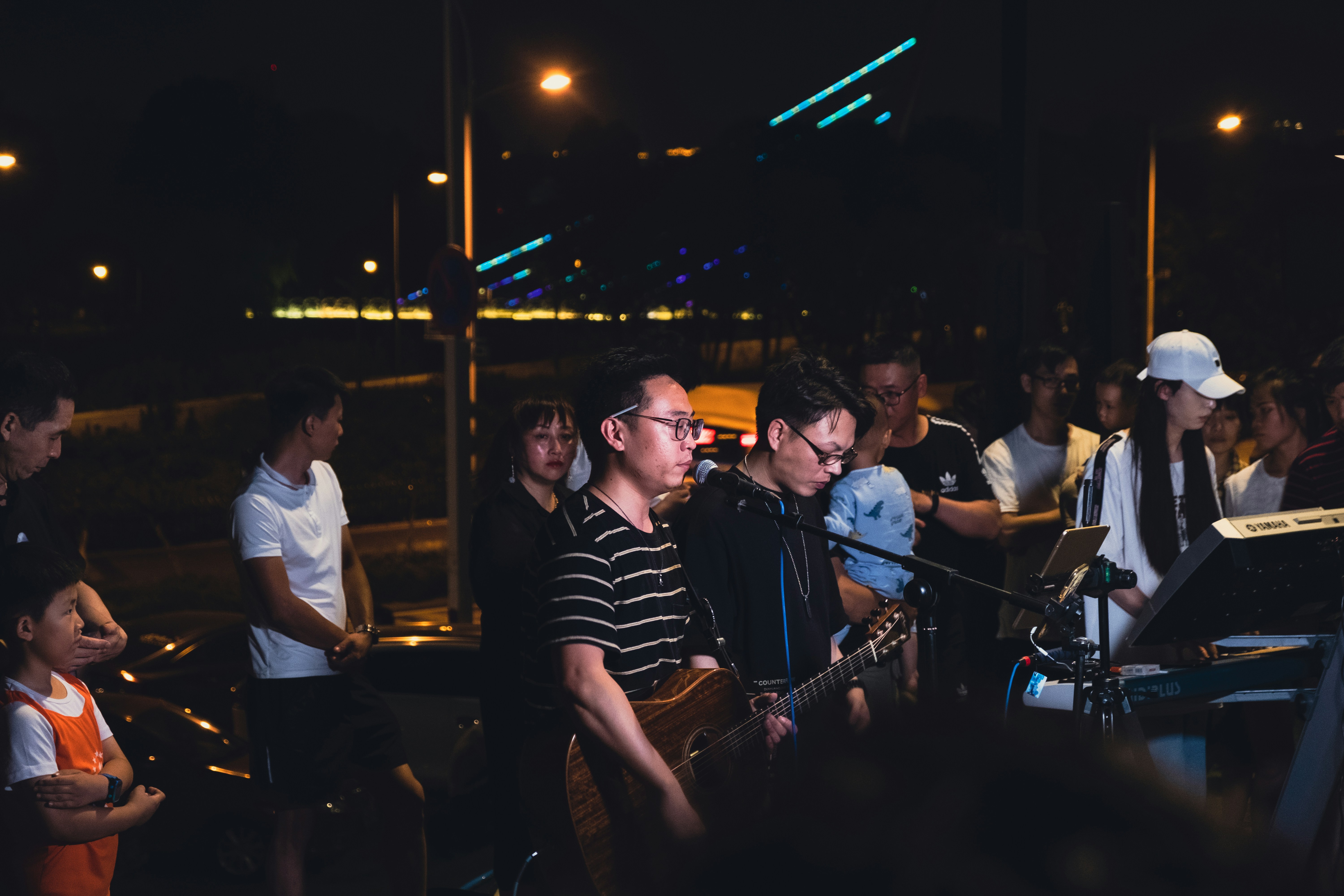 people playing musical instrument during night time