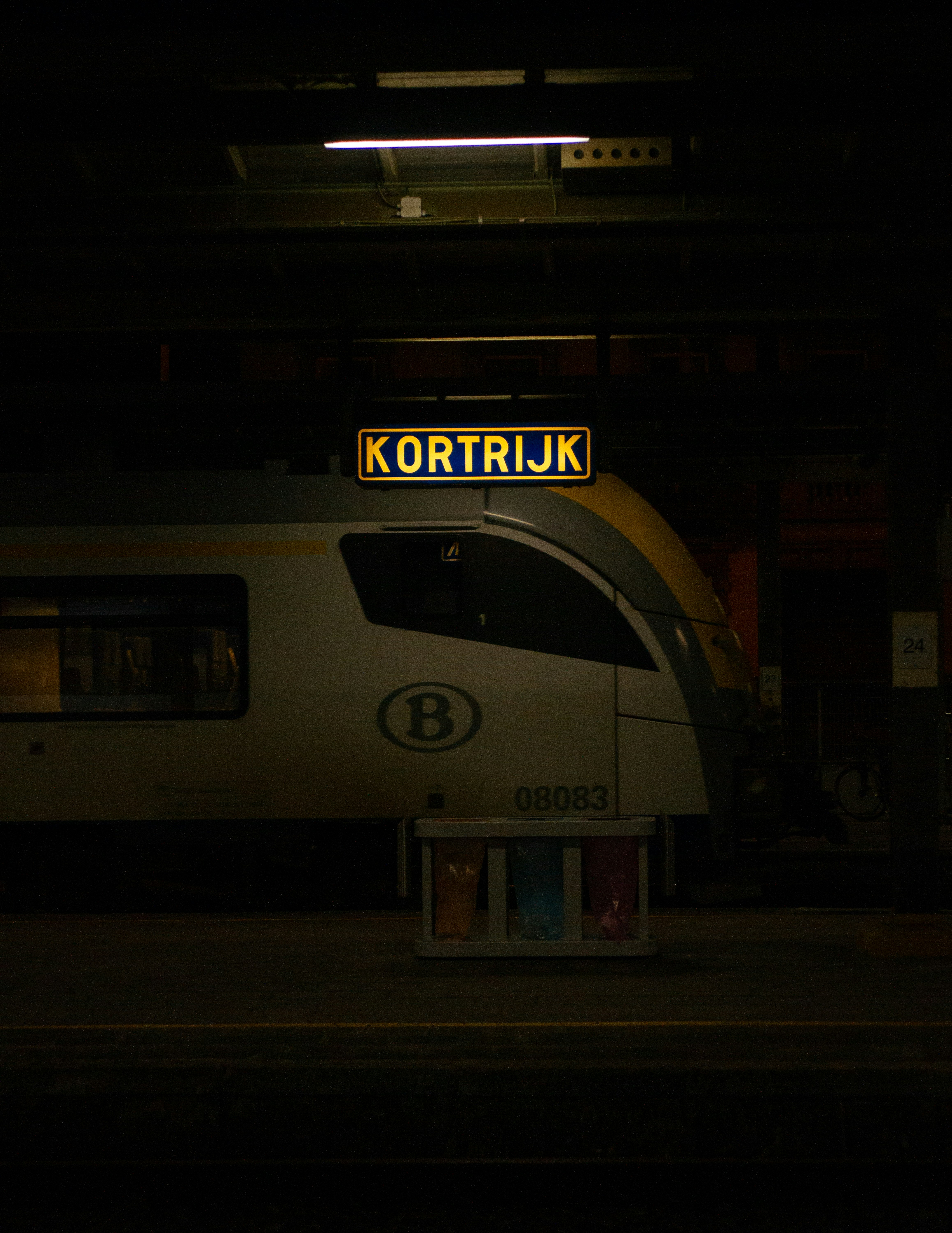 white and black train in the city during night time