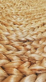 Close-up of rich brown coir fibers neatly bundled, highlighting natural texture.