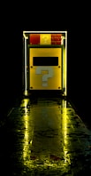 yellow and black door with yellow light