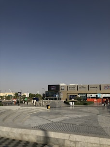 cars parked in front of building during daytime