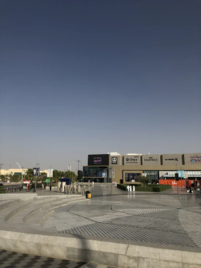 cars parked in front of building during daytime