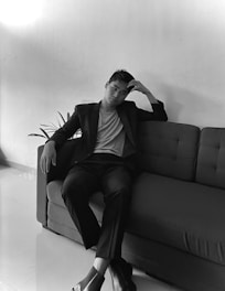 A Black lawyer calmly advising a client in a bright, minimalistic meeting room.