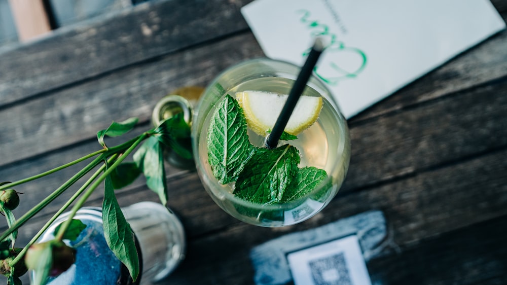 green leaf in clear glass cup