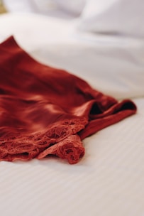 red lace panty on white textile