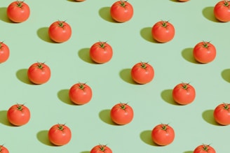 red cherry fruits on pink surface