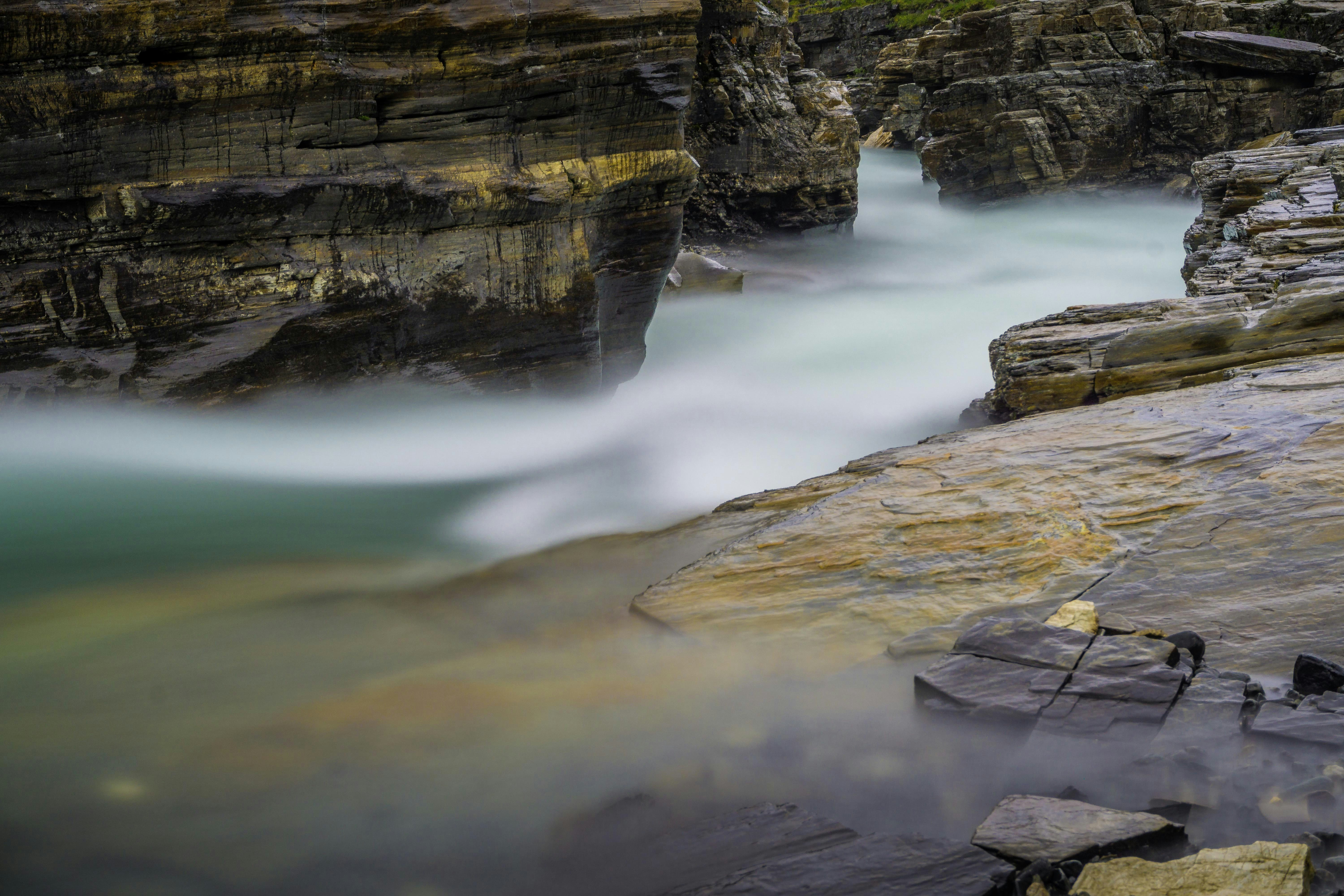 brown rocky mountain beside river