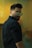 man in black dress shirt wearing black framed eyeglasses