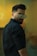 man in black dress shirt wearing black framed eyeglasses