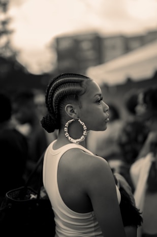 woman in white tank top wearing silver necklace