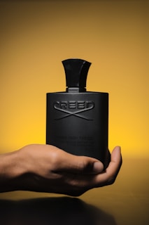 A live video screenshot showing the filling process of a Creed perfume decant