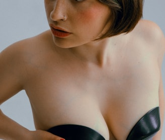 woman in black brassiere with red lipstick