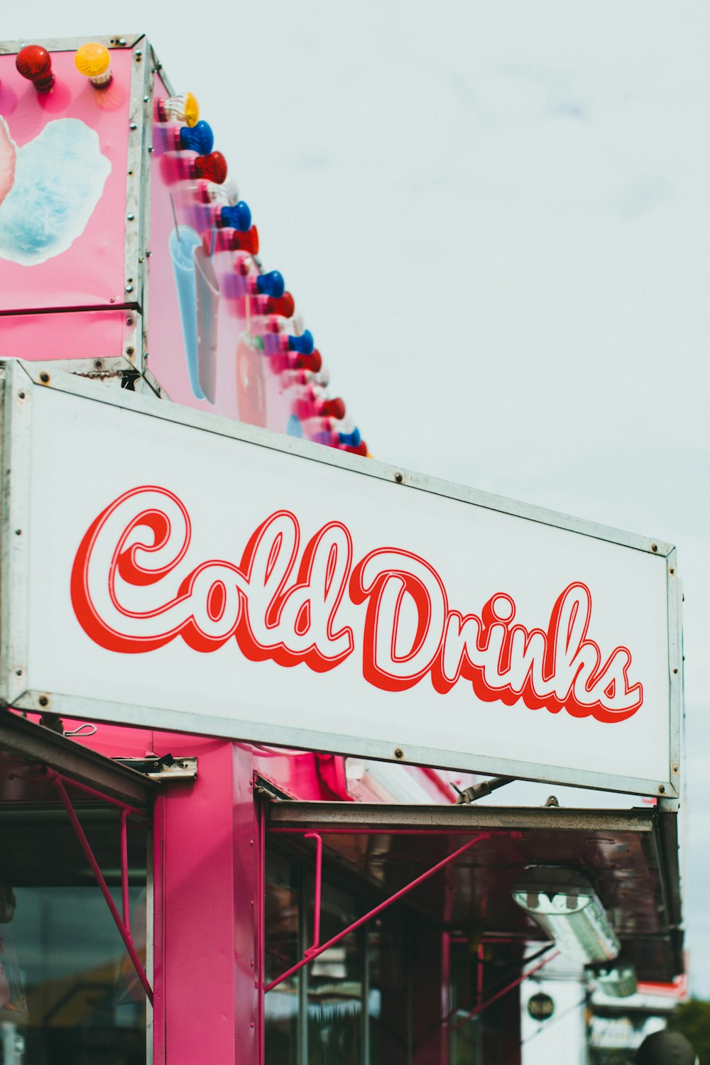 coca cola signage under white sky during daytime