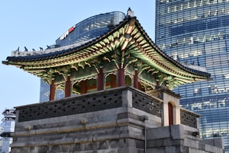 brown and green concrete building under blue sky during daytime