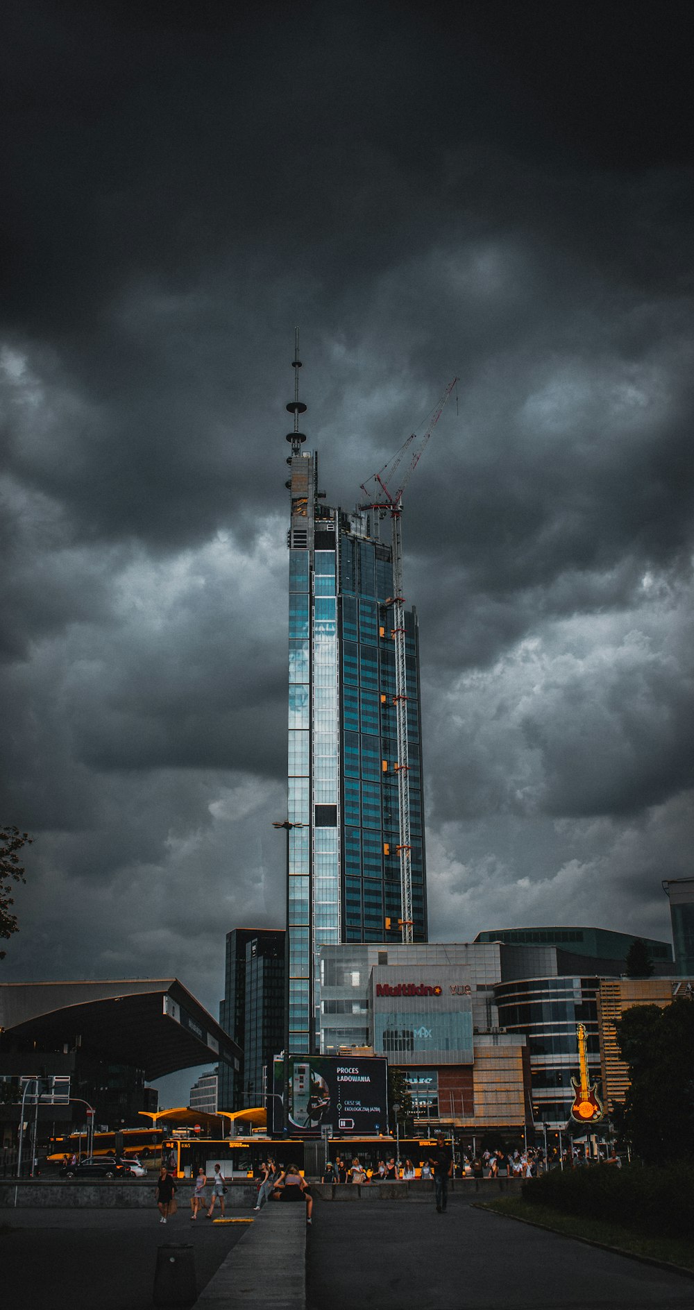 white and blue tower under gray clouds