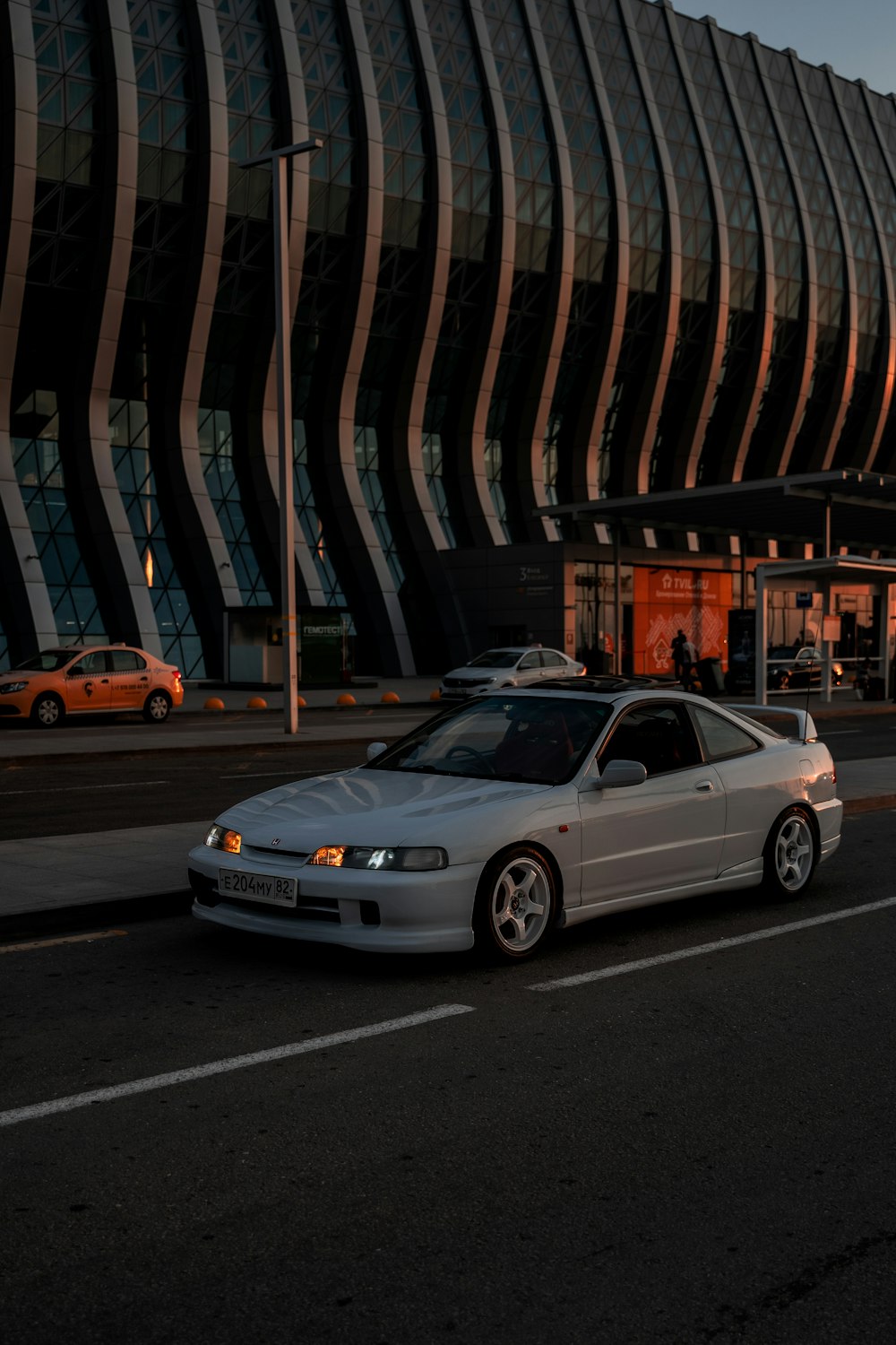 white bmw m 3 parked on parking lot