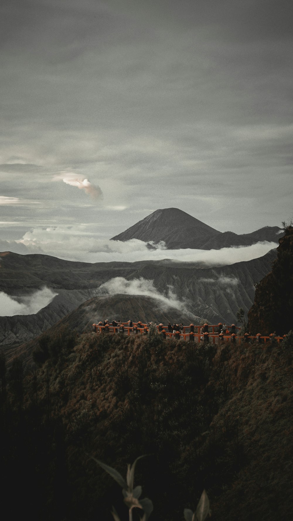 brown and black mountain under white clouds during daytime