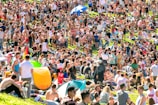 An outdoor scene with fans providing comfort on a sunny day.