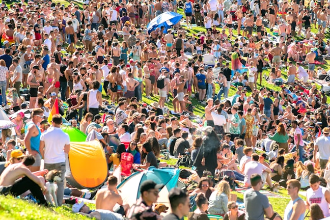 An outdoor scene with fans providing comfort on a sunny day.