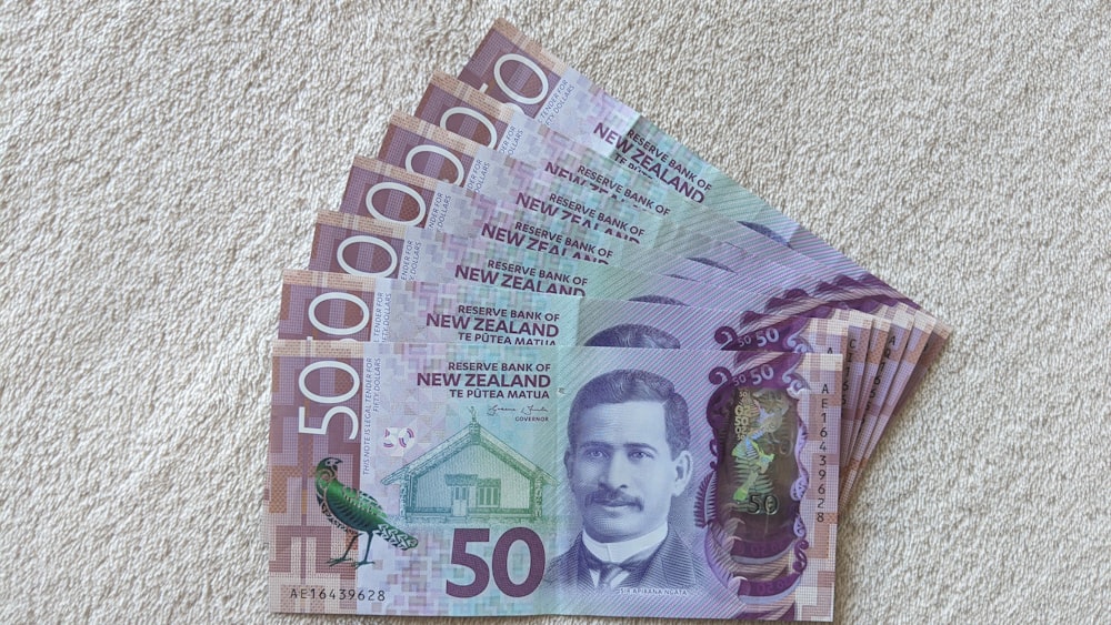 100 banknote on white textile