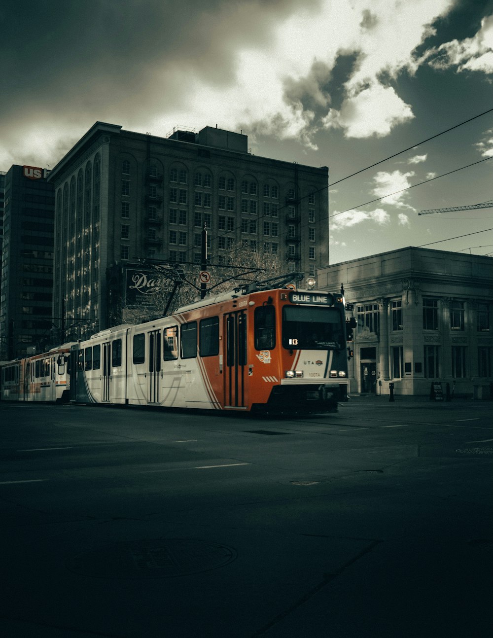 white and red train on rail road during daytime