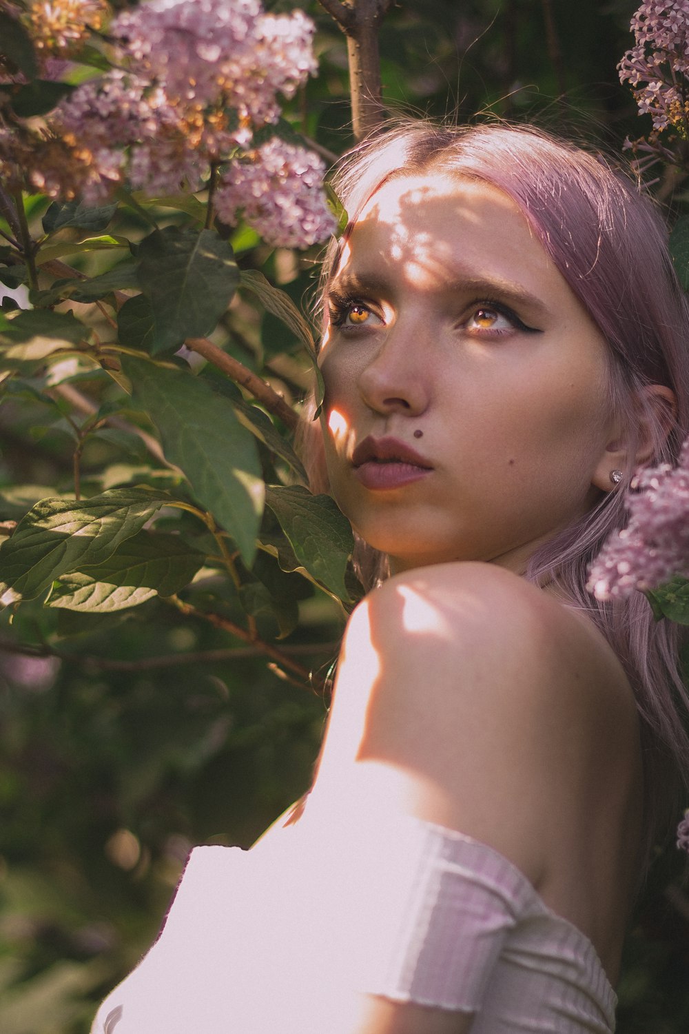 woman in white and black floral head dress