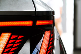 Close-up of a rugged trailer hitch with a smart sensor glowing softly, highlighting advanced safety features.