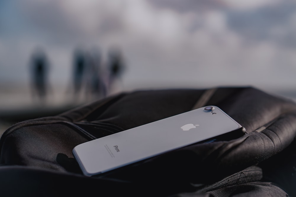 silver iphone 5s on white textile