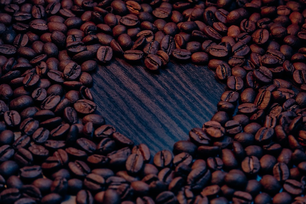 brown coffee beans on brown wooden table