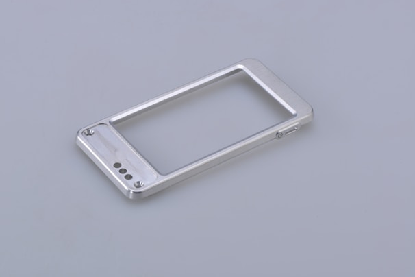 silver iphone 6 on white surface